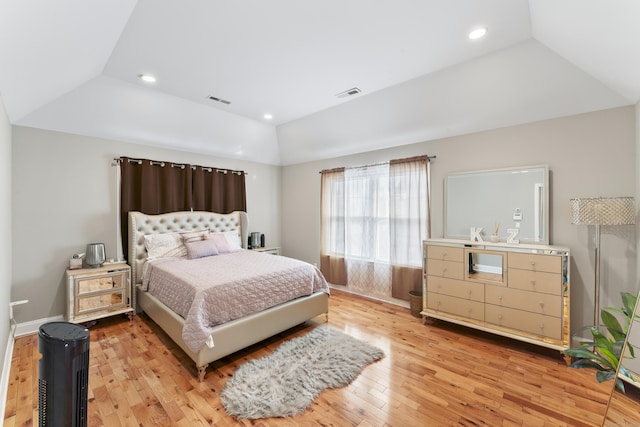 bedroom featuring vaulted ceiling, light wood-style flooring, visible vents, and recessed lighting