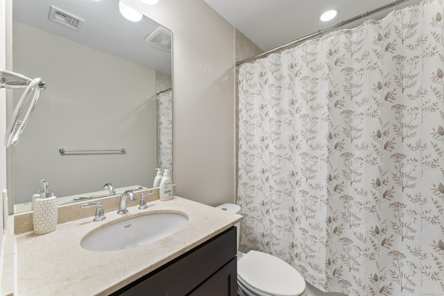 bathroom with toilet, visible vents, a shower with shower curtain, and vanity