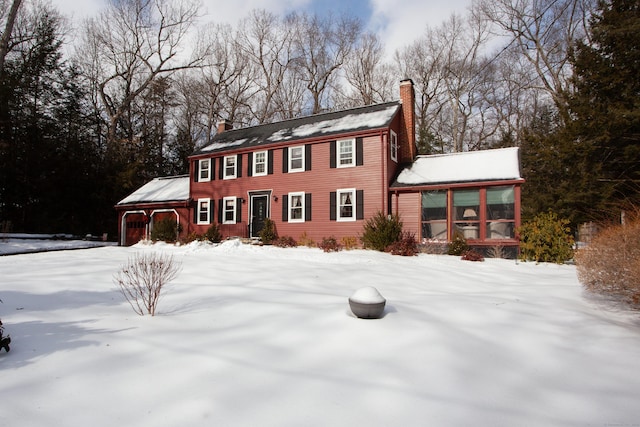 colonial home featuring a sunroom