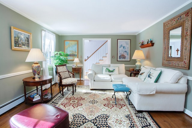 living room featuring ornamental molding, dark hardwood / wood-style flooring, and baseboard heating