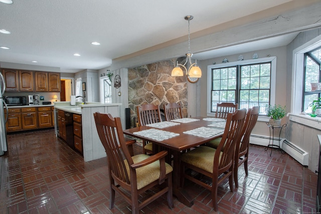 dining space with a baseboard radiator