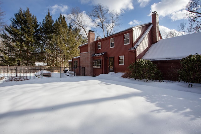 view of snow covered house