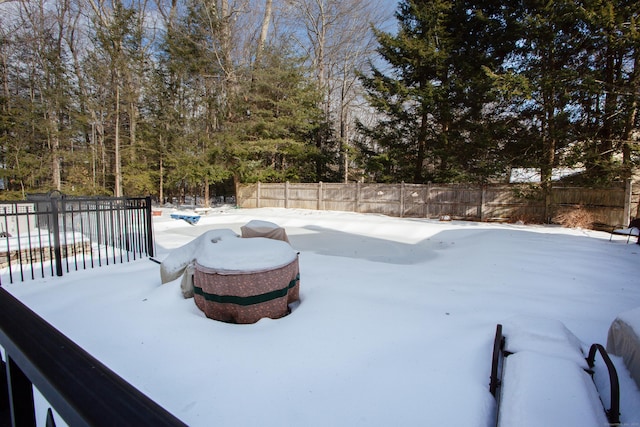 view of yard layered in snow