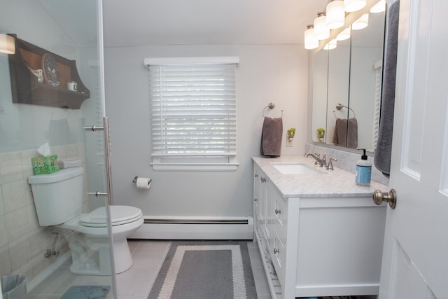 bathroom with baseboard heating, vanity, tile patterned flooring, and toilet