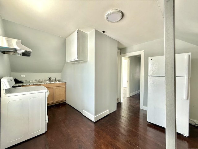 laundry room with dark wood-type flooring, sink, and washer and dryer