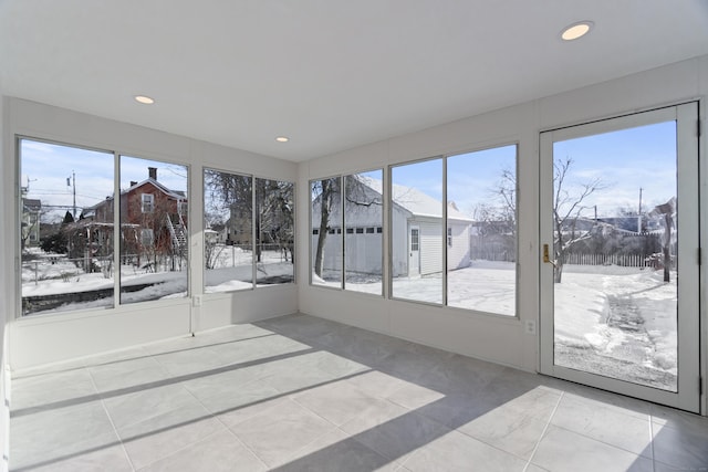 unfurnished sunroom featuring a residential view