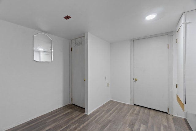 unfurnished bedroom featuring wood finished floors