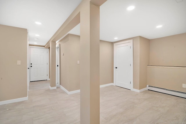 basement featuring a baseboard radiator