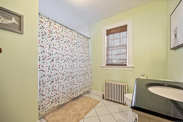 bathroom with curtained shower, toilet, radiator heating unit, vanity, and tile patterned flooring