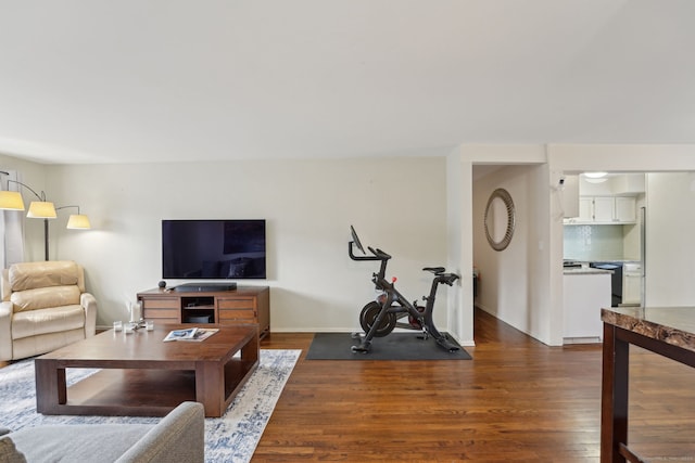 living room with dark wood finished floors and baseboards