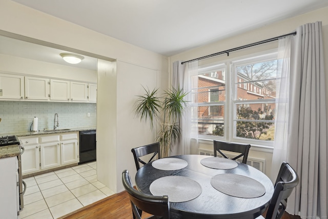 dining area featuring light tile patterned floors