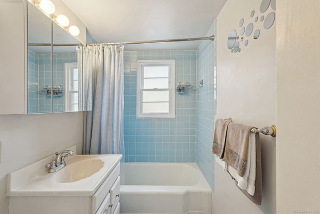 full bath featuring vanity and shower / bath combo with shower curtain