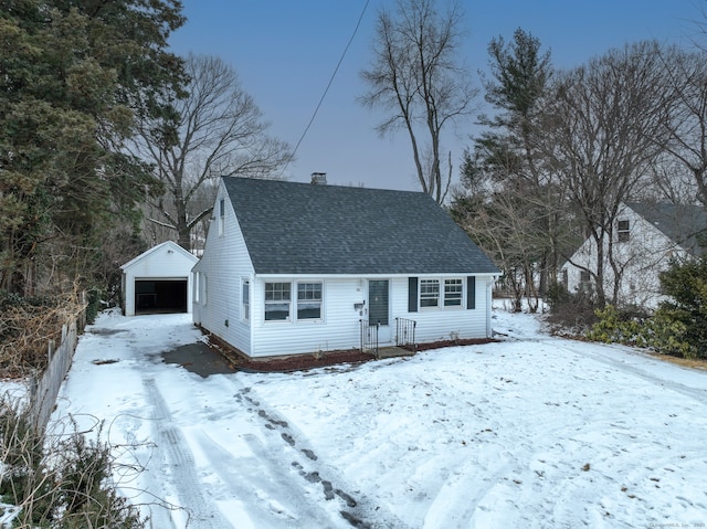 view of front of house featuring a garage and an outdoor structure