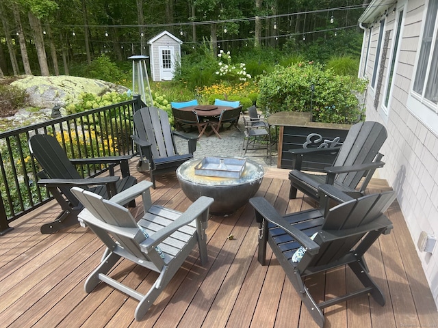 wooden deck featuring outdoor dining space