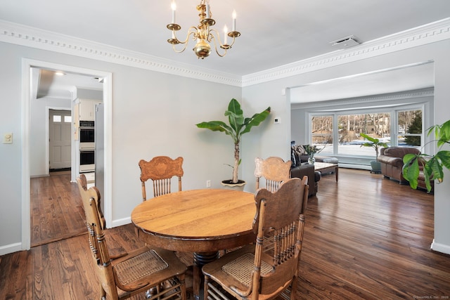 dining area with a notable chandelier, visible vents, baseboards, dark wood finished floors, and crown molding