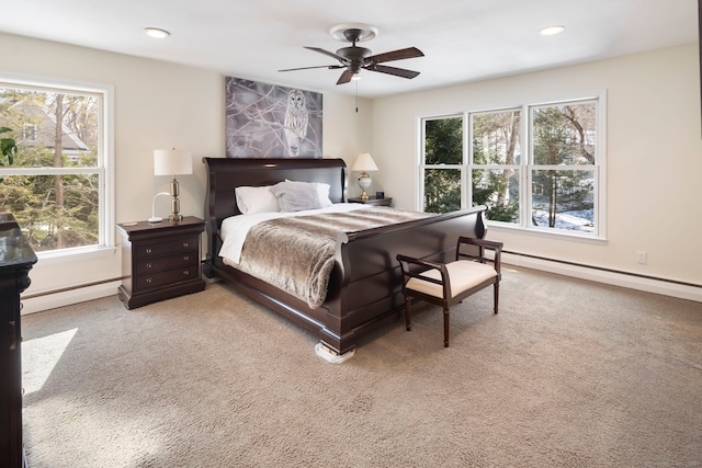 carpeted bedroom with recessed lighting, baseboards, and baseboard heating