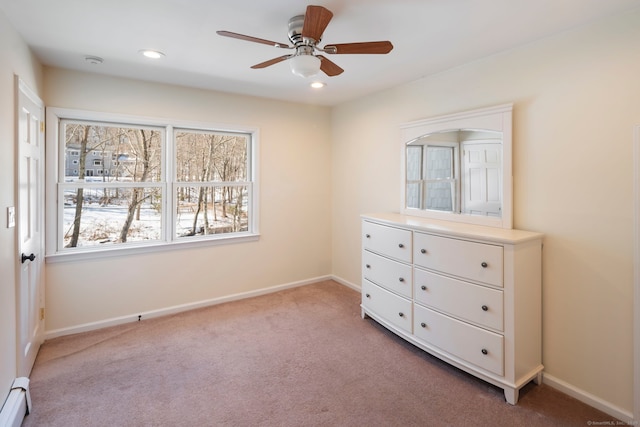 unfurnished bedroom with baseboards, baseboard heating, recessed lighting, and light colored carpet