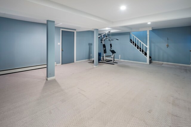 workout area featuring recessed lighting, baseboards, baseboard heating, and light colored carpet