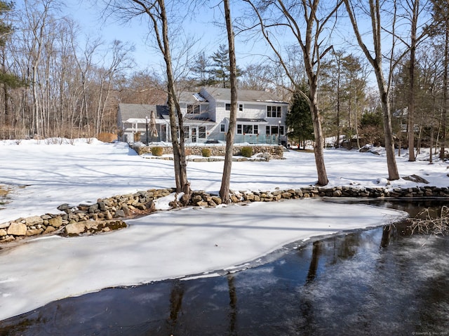 view of yard layered in snow