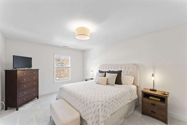 bedroom featuring light colored carpet