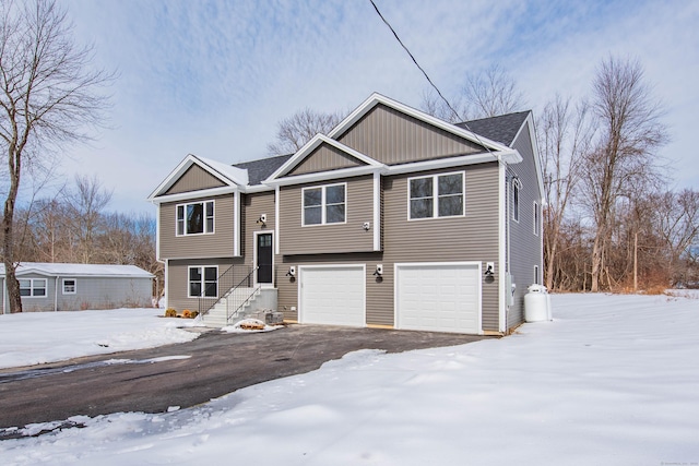 split foyer home featuring driveway and an attached garage