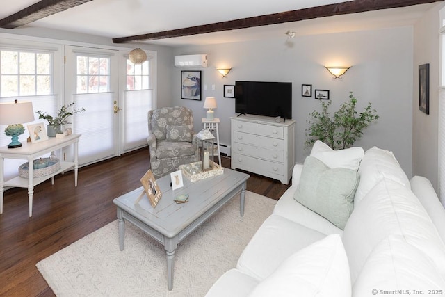 living room with dark hardwood / wood-style flooring, beam ceiling, and a wall mounted AC