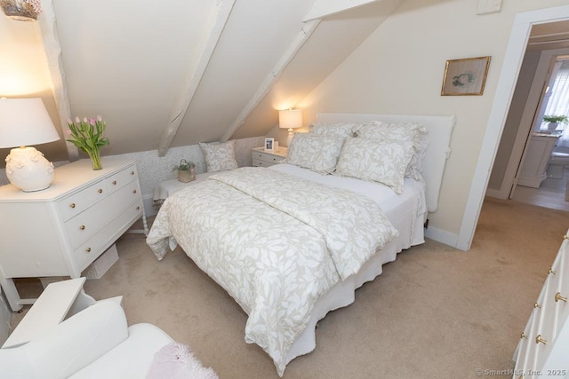 carpeted bedroom with vaulted ceiling