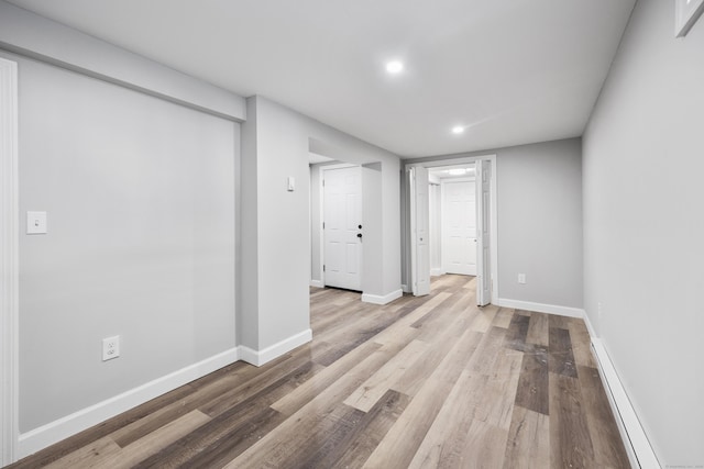 spare room featuring light hardwood / wood-style flooring