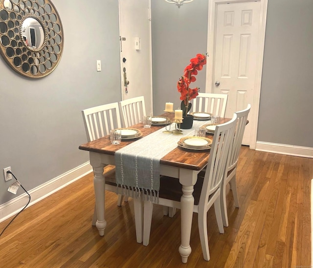 dining space featuring dark wood-type flooring