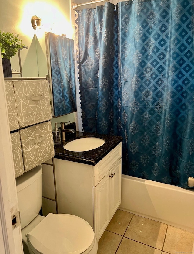 full bathroom featuring vanity, toilet, tile patterned flooring, and shower / bath combo with shower curtain