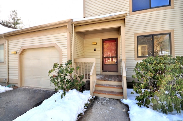 view of snow covered property entrance