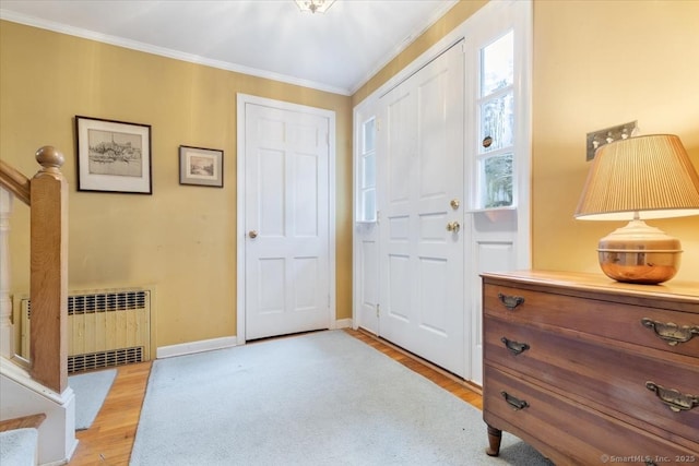31 Pawson Rd, Branford, CT 06405 - foyer entrance with ornamental molding, radiator heating unit, light wood-type flooring, and baseboards