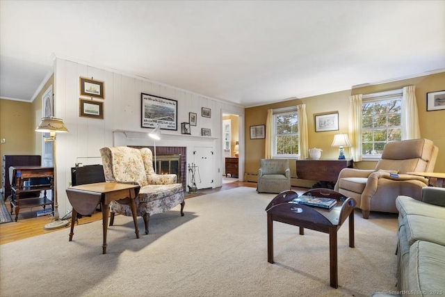 31 Pawson Rd, Branford, CT 06405 - living room with a baseboard heating unit, a brick fireplace, light colored carpet, and crown molding