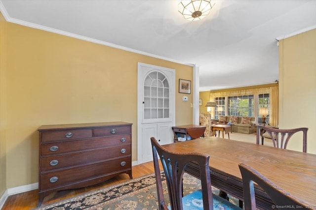 31 Pawson Rd, Branford, CT 06405 - dining room with baseboards, ornamental molding, and wood finished floors