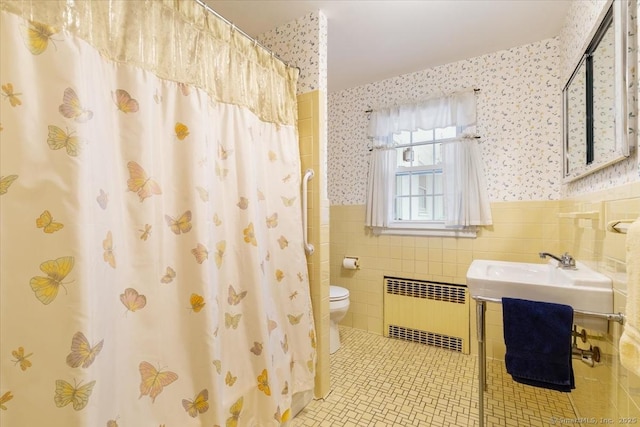 31 Pawson Rd, Branford, CT 06405 - bathroom featuring a wainscoted wall, tile walls, wallpapered walls, radiator heating unit, and tile patterned floors