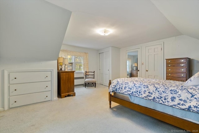 31 Pawson Rd, Branford, CT 06405 - bedroom featuring light carpet, radiator heating unit, vaulted ceiling, and multiple closets