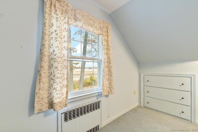 31 Pawson Rd, Branford, CT 06405 - bonus room featuring vaulted ceiling, radiator heating unit, baseboards, and light colored carpet