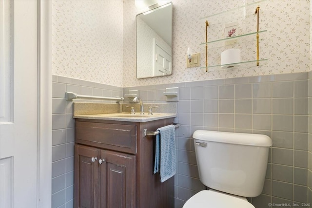 31 Pawson Rd, Branford, CT 06405 - half bathroom with a wainscoted wall, vanity, toilet, and wallpapered walls