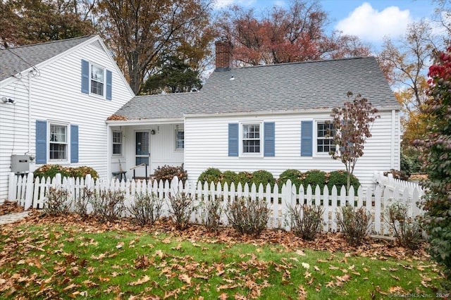 31 Pawson Rd, Branford, CT 06405 - view of front of home featuring a fenced front yard, a chimney, and a shingled roof