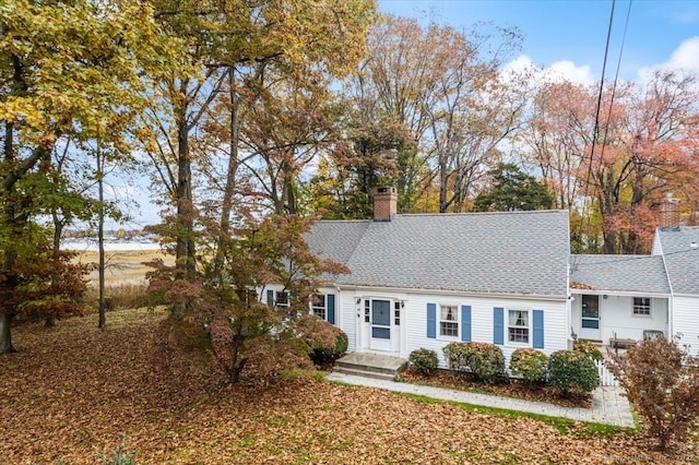 31 Pawson Rd, Branford, CT 06405 - cape cod-style house featuring a shingled roof and a chimney