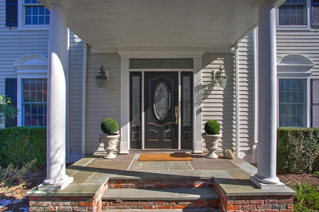 doorway to property with a porch