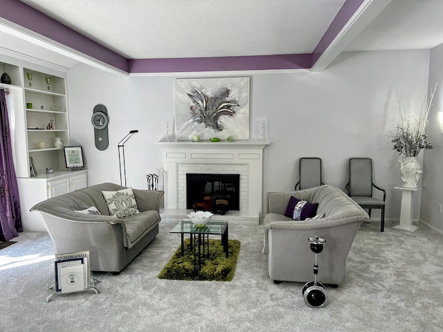 carpeted living area with a textured ceiling, a brick fireplace, and baseboards