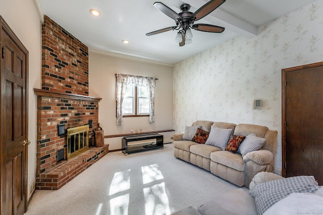 living room featuring beam ceiling, light colored carpet, a brick fireplace, baseboards, and wallpapered walls