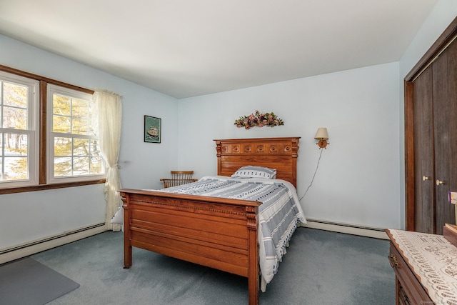 bedroom with a baseboard radiator and carpet flooring