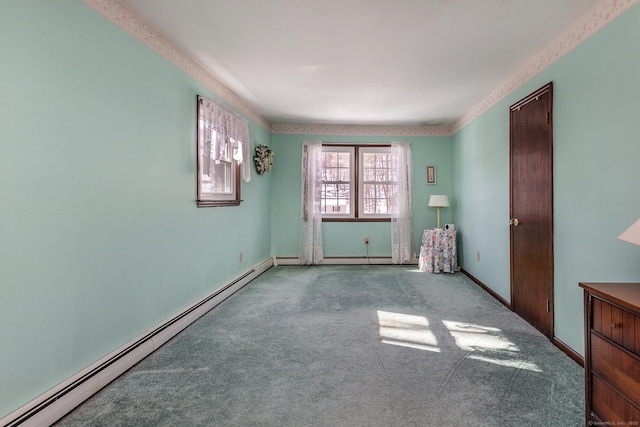 carpeted spare room featuring baseboard heating and baseboards