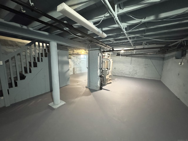unfinished below grade area featuring stairway