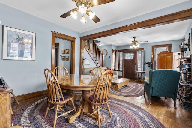 dining space featuring ceiling fan and wood-type flooring