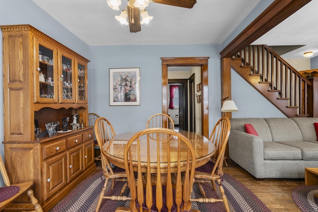 dining room featuring dark wood-type flooring and ceiling fan