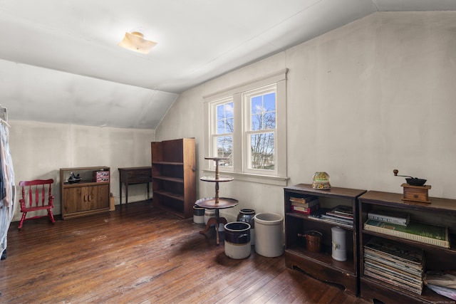 bonus room featuring dark hardwood / wood-style flooring and vaulted ceiling