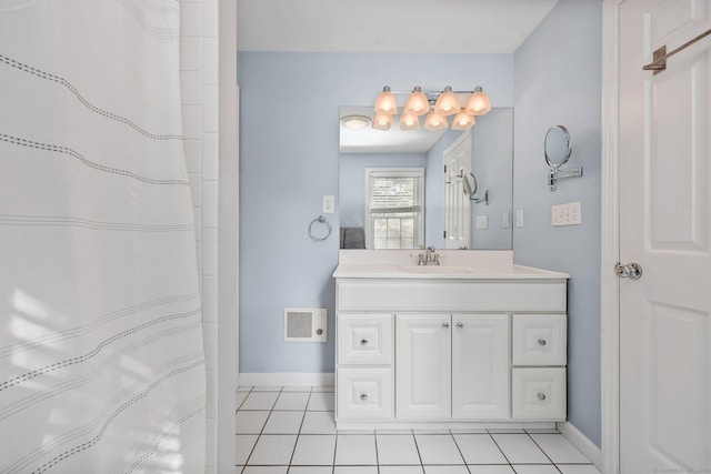 bathroom featuring tile patterned flooring and vanity